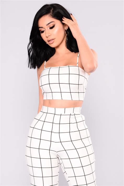 2 Piece Matching Set Faux Leather Sleeveless Crop Top Functional Back Zipper Straight Leg Pant Cage Detail Stretch Disclaimer Print Placement May Vary Self 100 Polyester Contrast 95 Polyester 5 Spandex Lining 100 Polyester Imported from Fashion Nova. . Fashion nova pants set